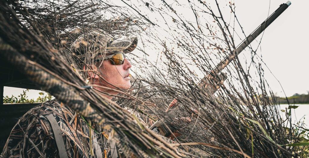 duck hunter in blind hunting private land